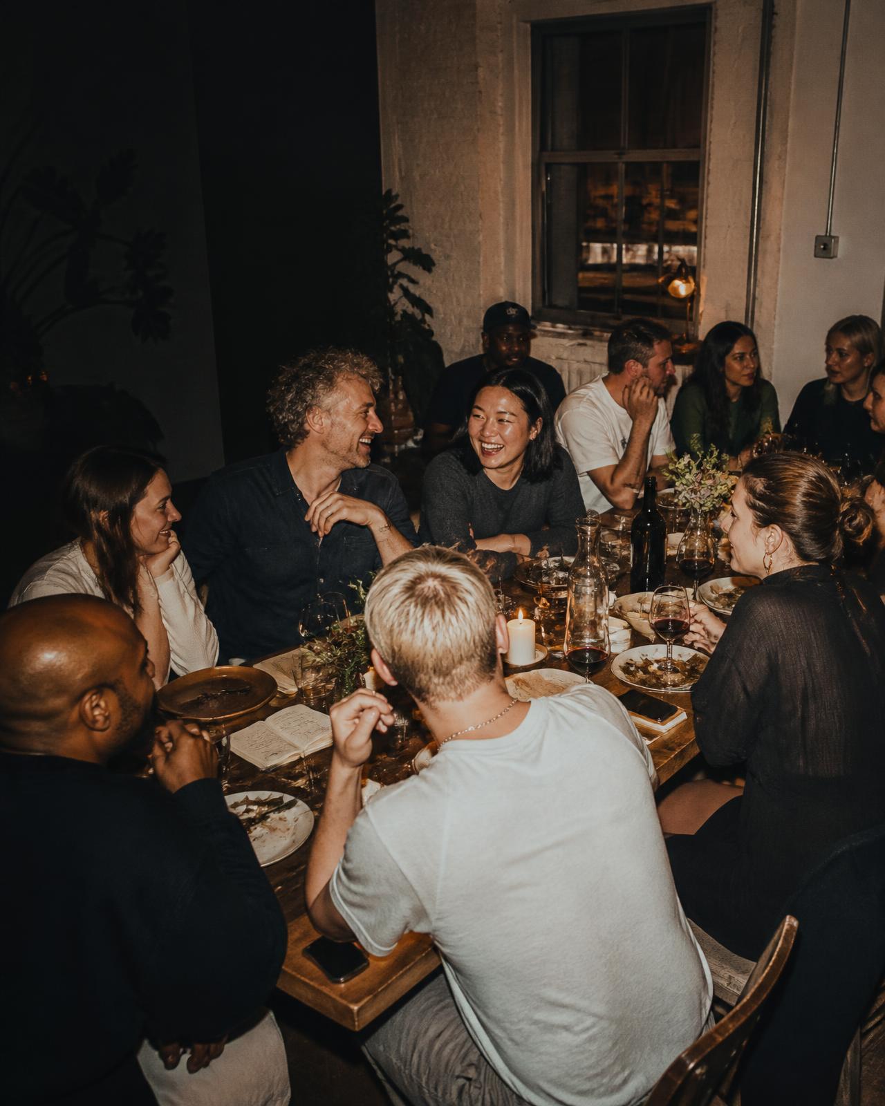 Agency founders sharing ideas around a dinner table